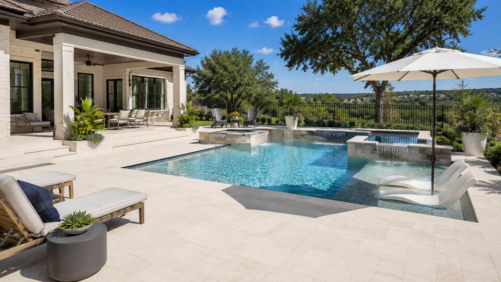 Light-colored pool deck surrounding a swimming pool, designed to stay more comfortable under the hot Texas sun.